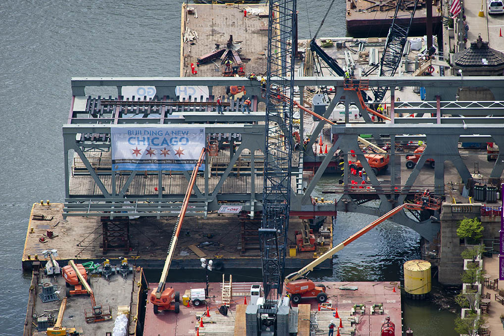 Image of workers building a bridge across the Chicago River